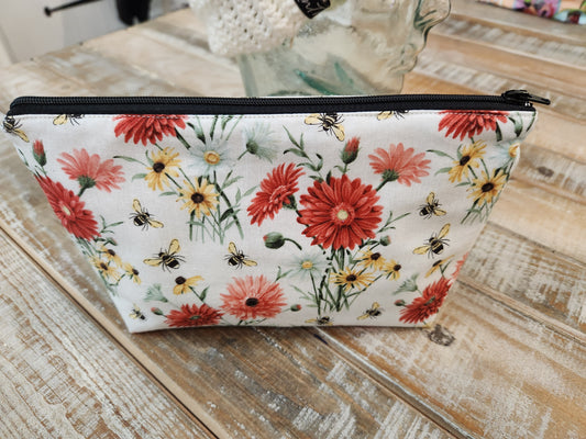 Red and yellow daisies with bees zipper pouch