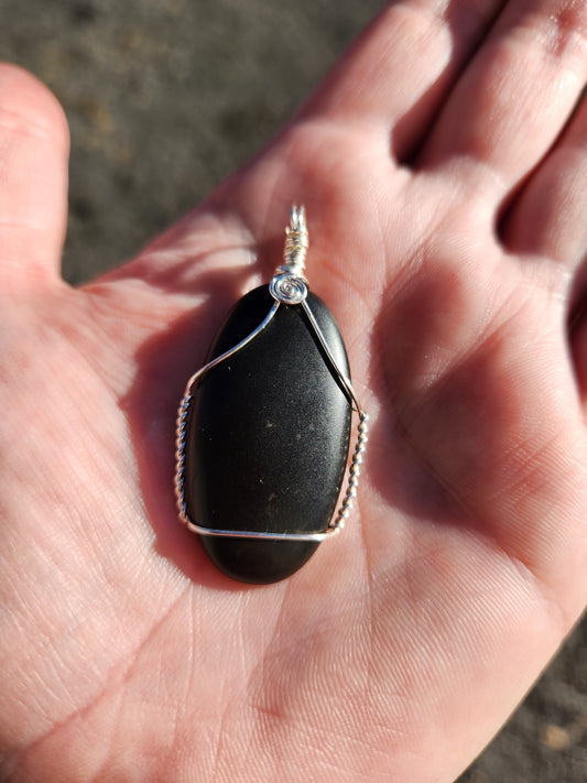 Silver wrapped matte black stone pendant