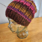 Bright fall colors with vivid pink hat