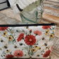 Red and yellow daisies with bees zipper pouch