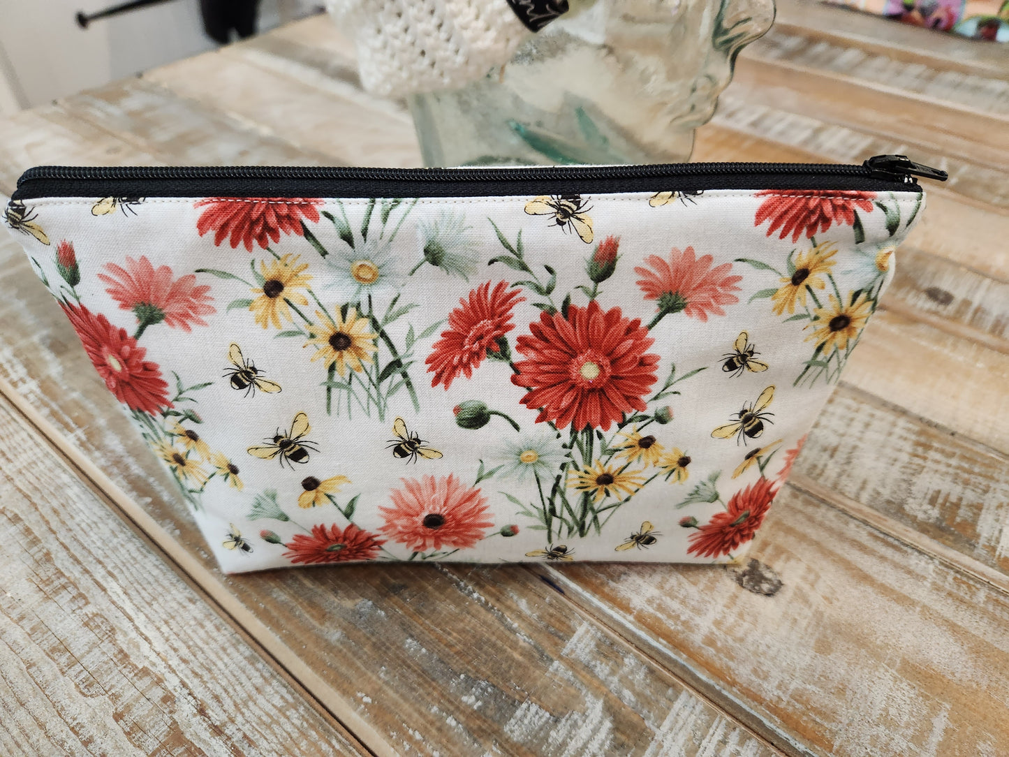 Red and yellow daisies with bees zipper pouch