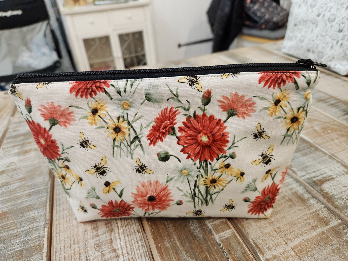 Red and yellow daisies with bees zipper pouch