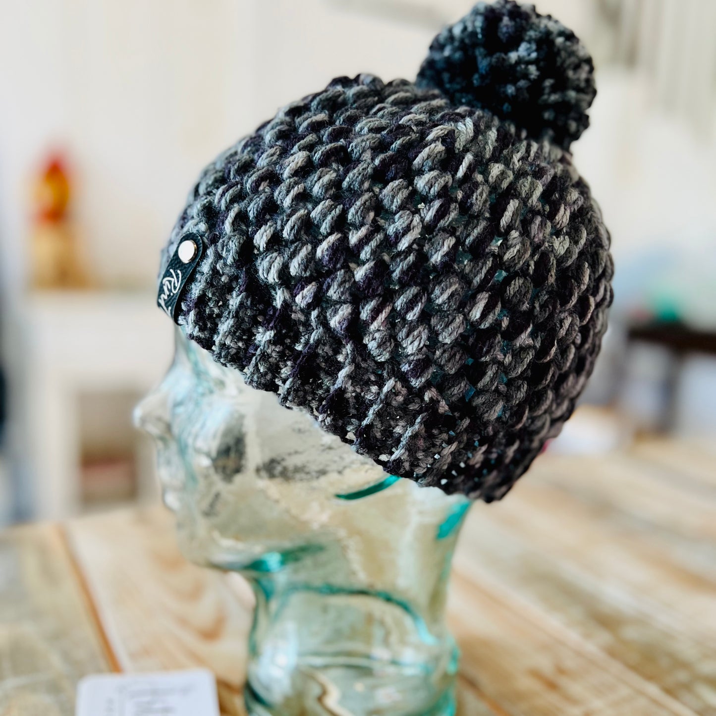 Black & grey crochet pom pom beanie