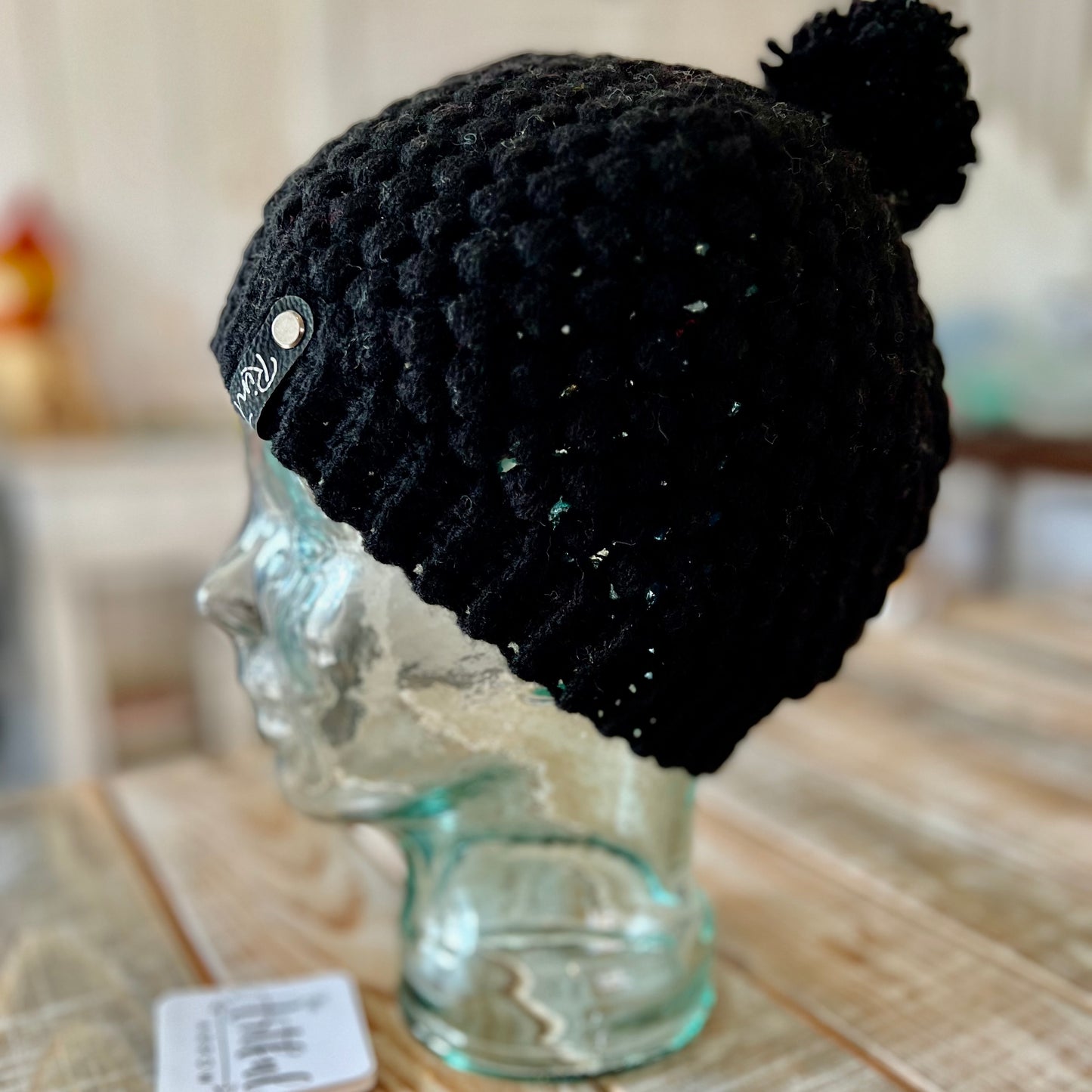 Black pom pom beanie