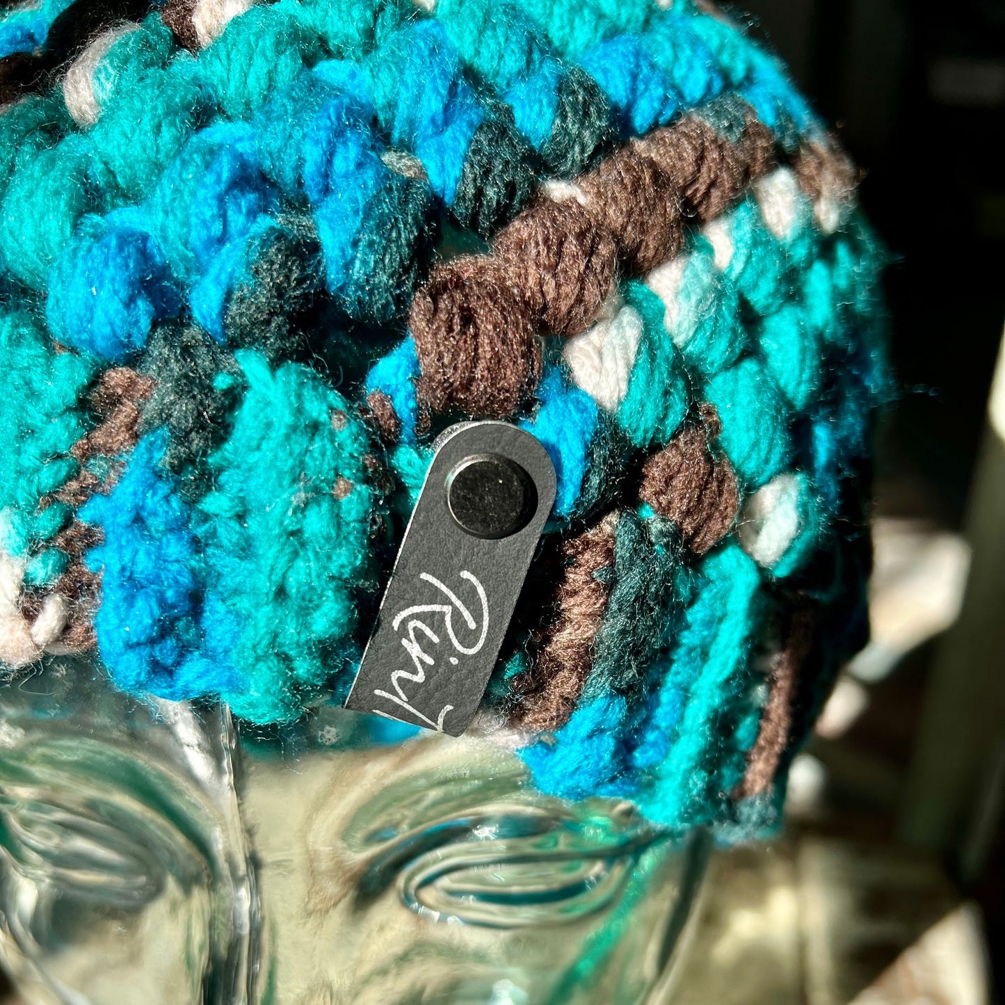 Blue and brown multicolor pom pom beanie