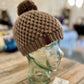 Dark mushroom brown pom pom beanie