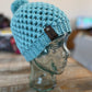 Light blue-green pom pom beanie