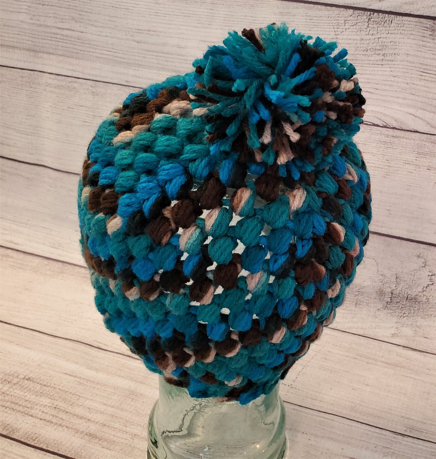 Blue and brown multicolor pom pom beanie