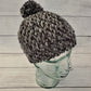 Black & grey crochet pom pom beanie