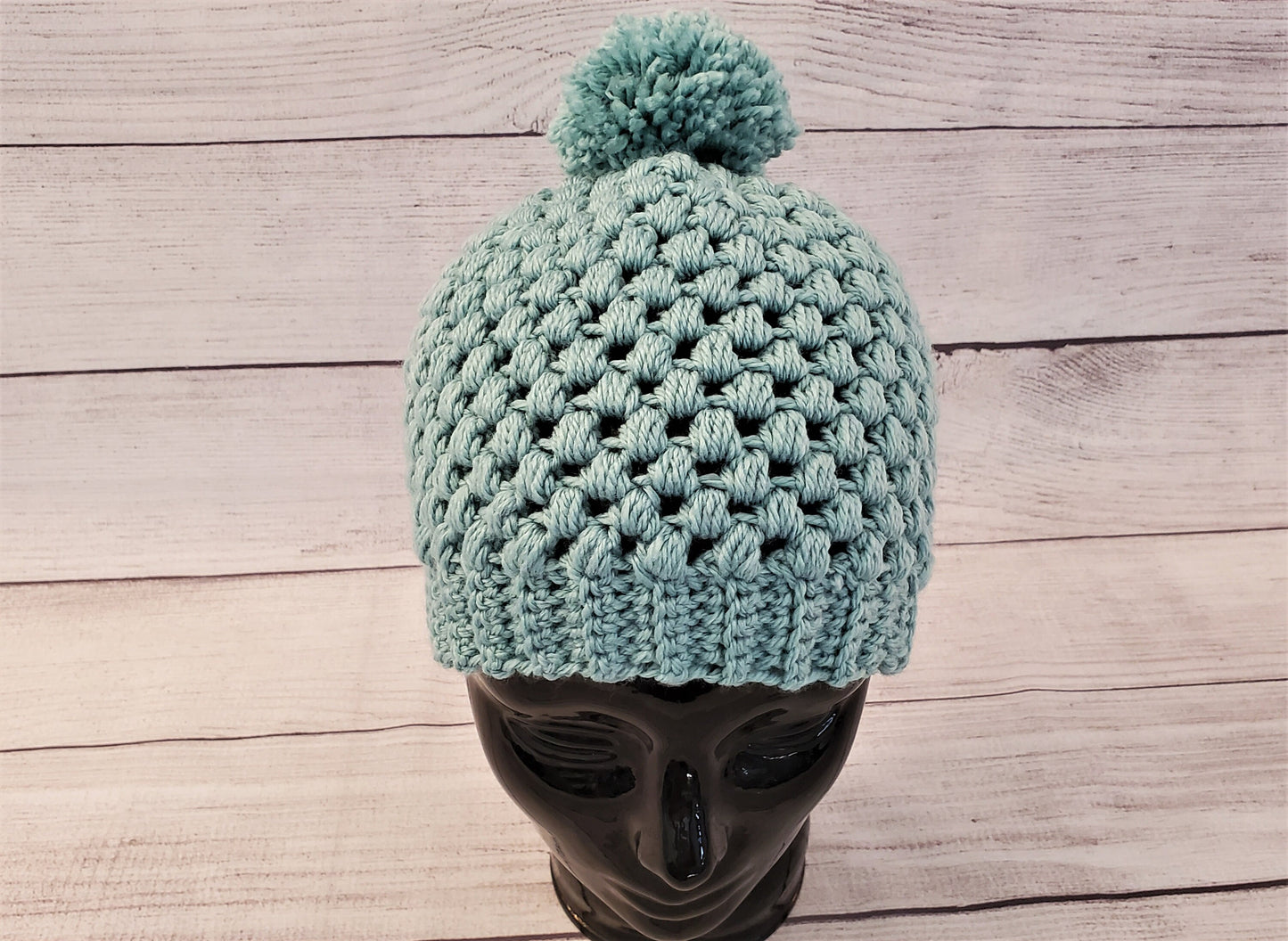 Light blue-green pom pom beanie