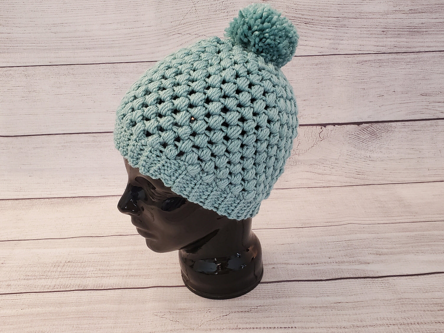 Light blue-green pom pom beanie